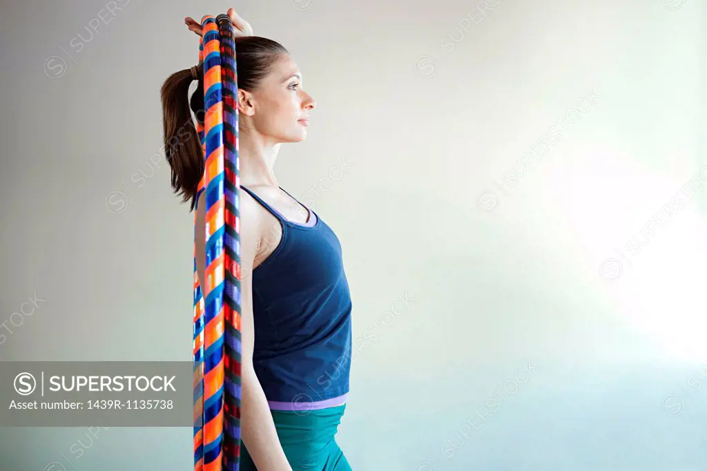 Woman holding plastic hoop for pilates