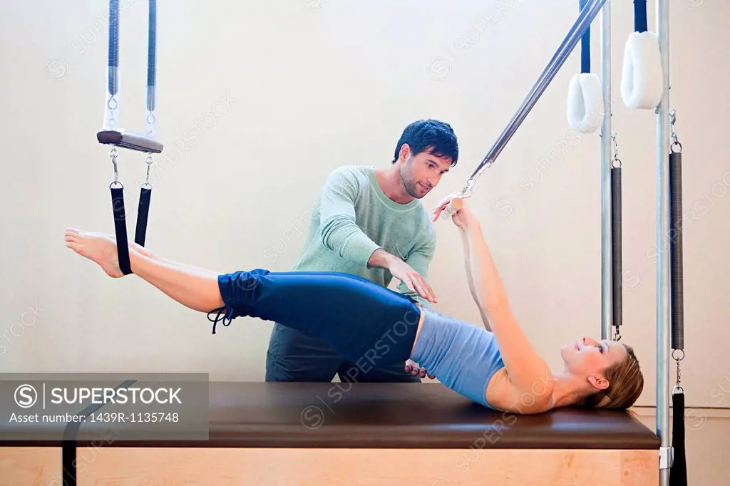 Women doing pilates with instructor