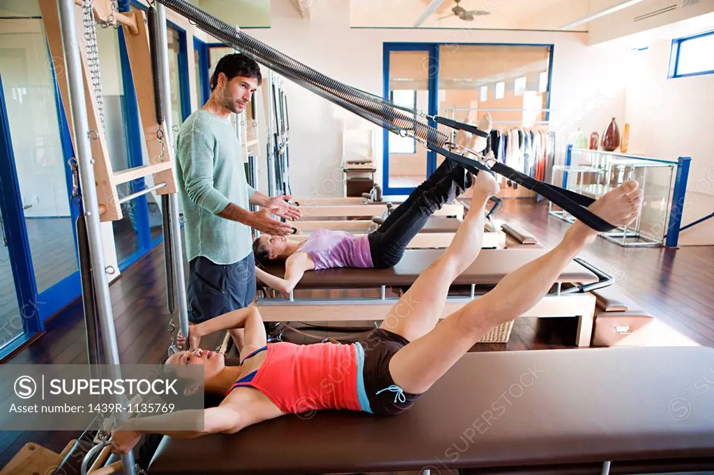 Women with pilates instructor