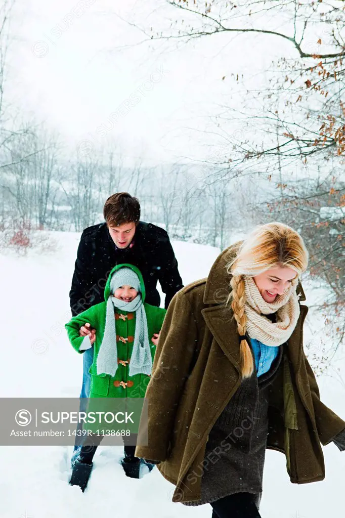 Family walking in snow