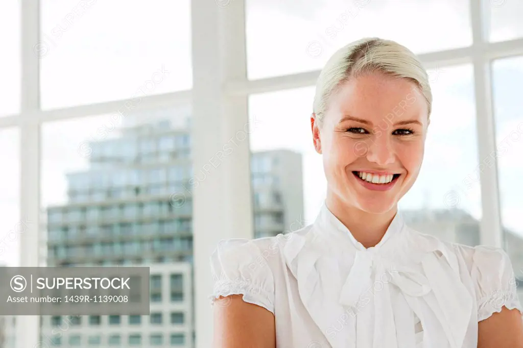 Businesswoman wearing white blouse, portrait