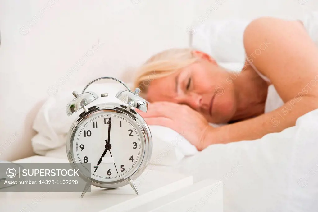 Mature woman asleep in bed
