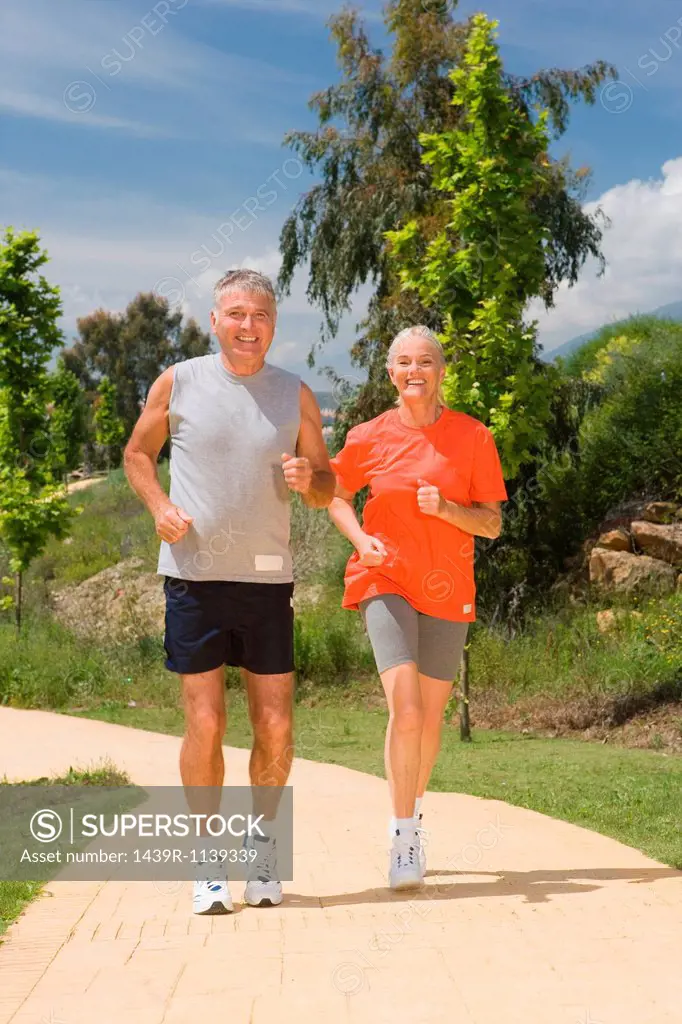 Mature couple jogging together
