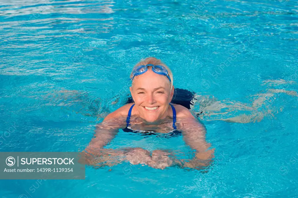 Mature woman swimming in pool
