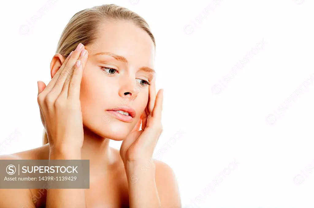 Young woman contemplating face lift