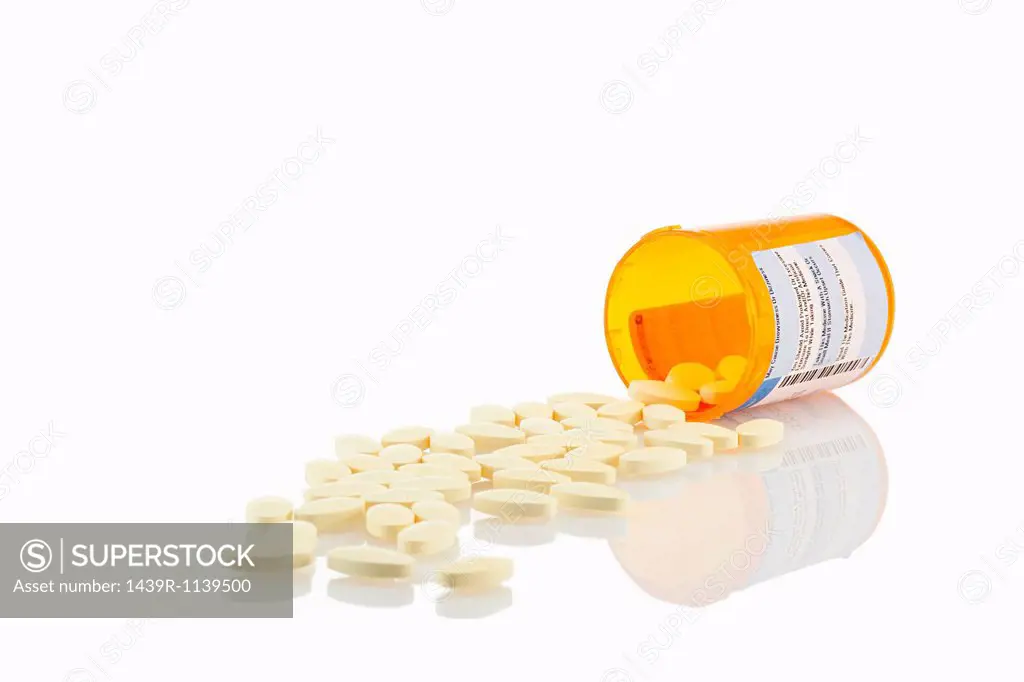 Pills spilling from container