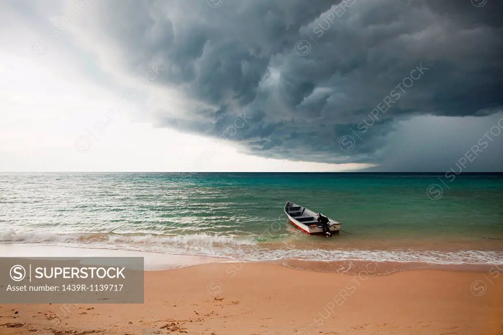 Boat on sea under stormy sky, Perhentian Kecil, Malaysia