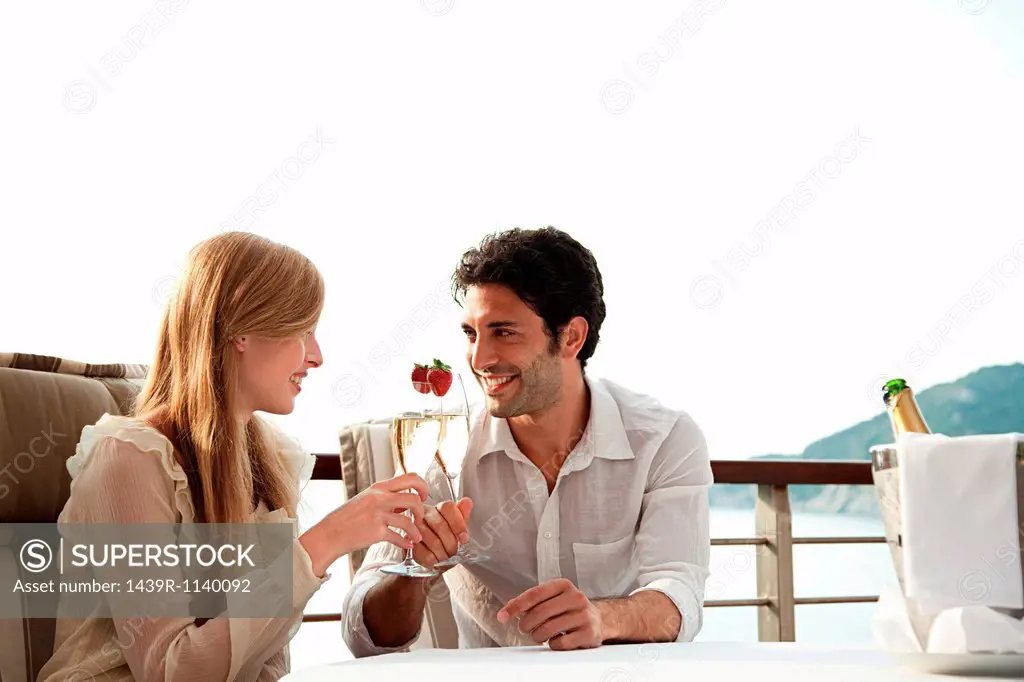 Young couple toasting with champagne
