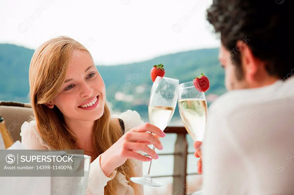 Young couple toasting with champagne