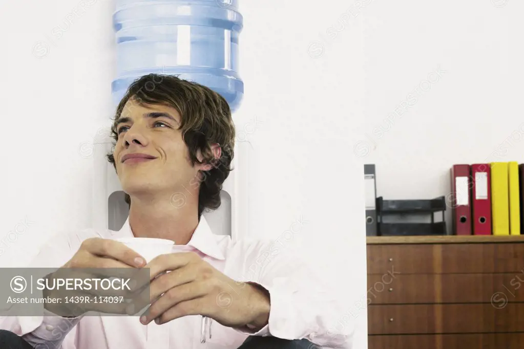 Businessman sitting next to mineral water