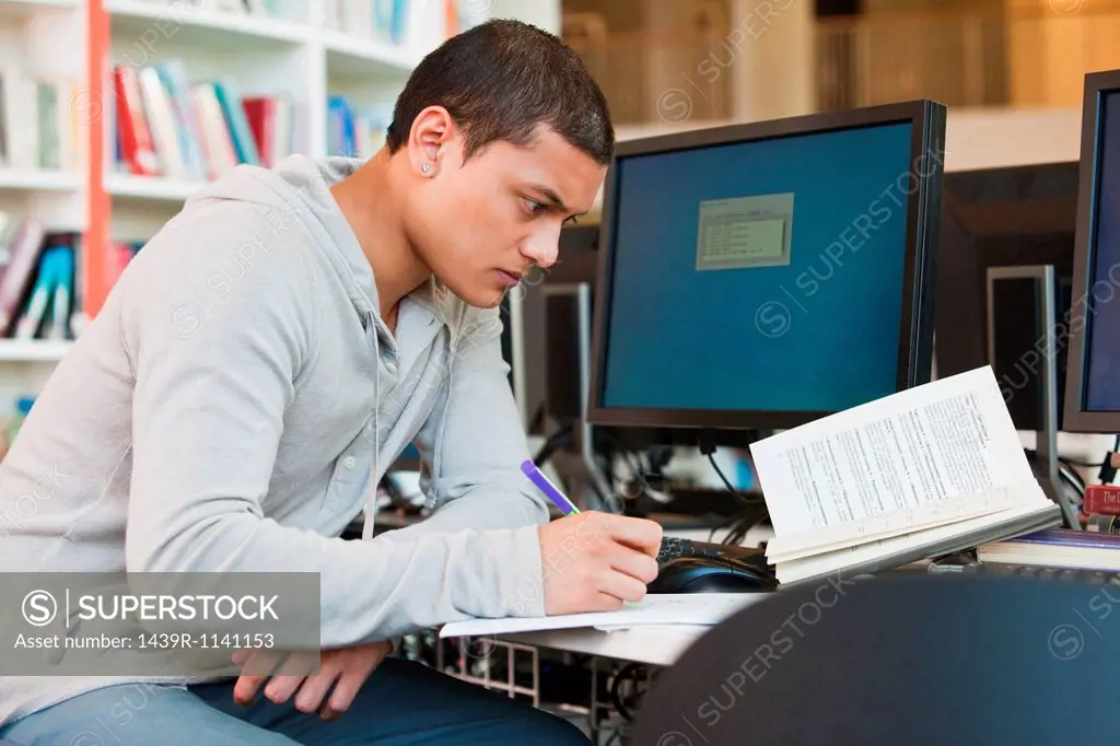 University student working at computer desk