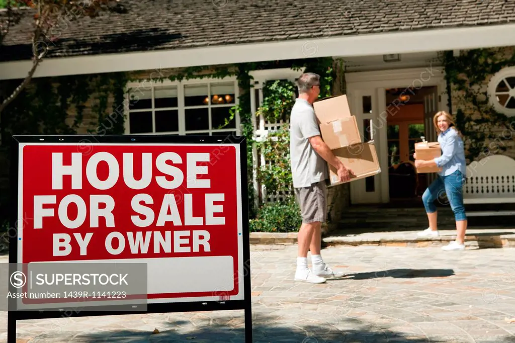 Mature couple moving into newly bought property