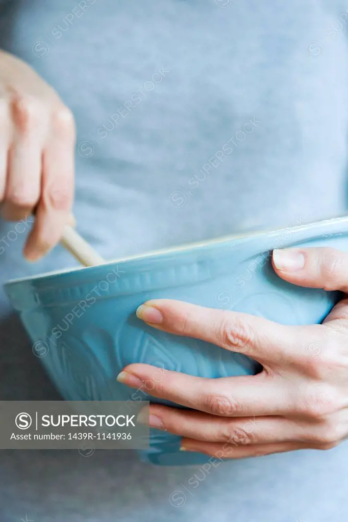 Woman with mixing bowl