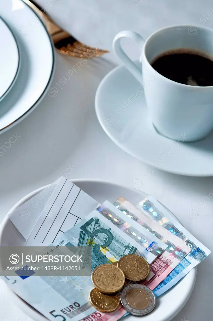 Payment and coffee on restaurant table