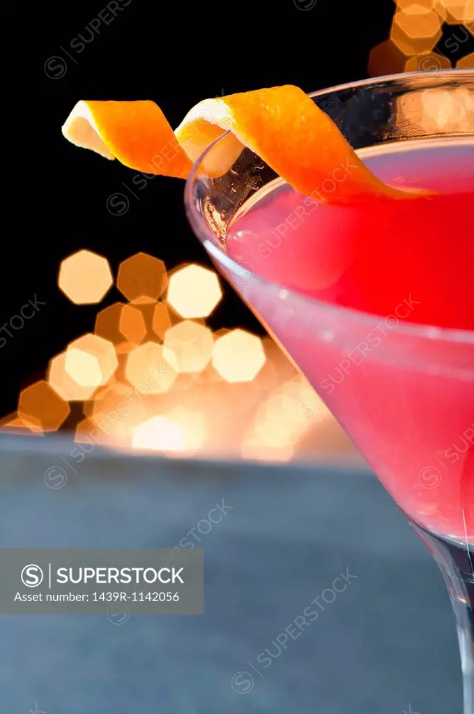 Cosmopolitan cocktail with twist of orange peel