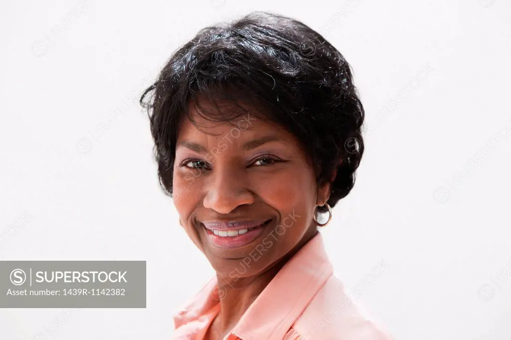 Portrait of smiling African American mature woman, studio shot