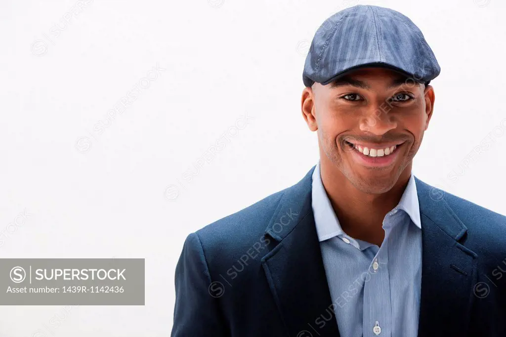 Portrait of African American man wearing cap, studio shot
