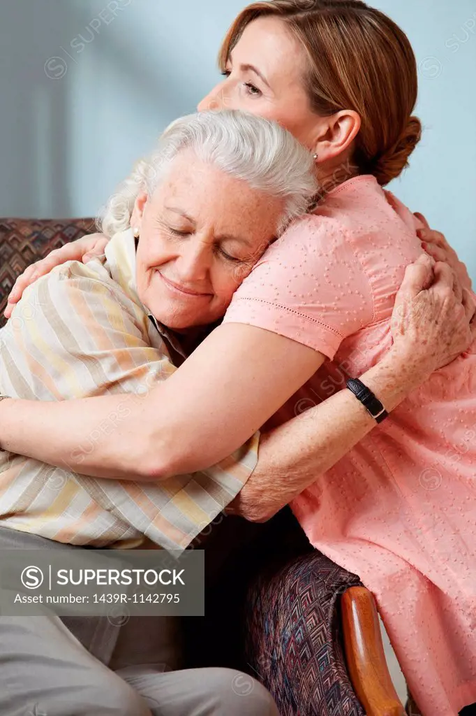 Daughter and senior mother embracing