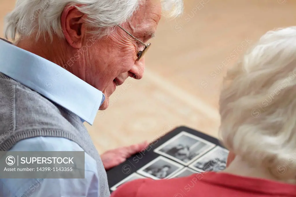 Senior couple looking at photo album