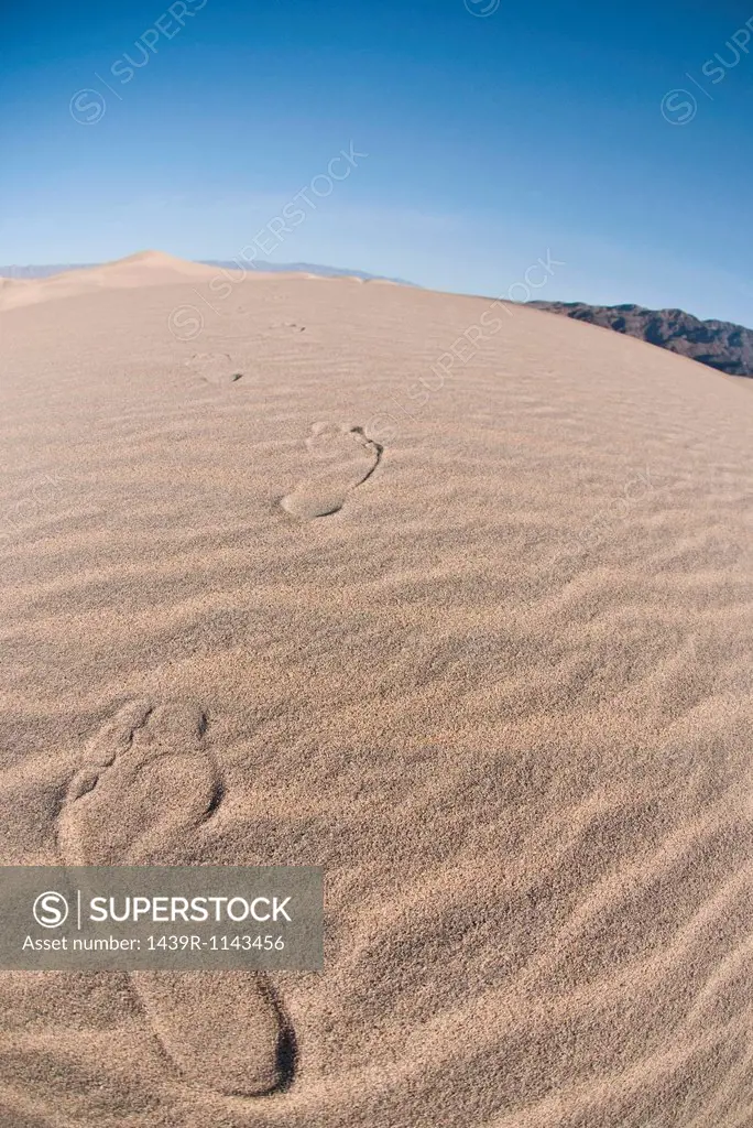 Footprints in sand dune in Death Valley National Park, California, USA