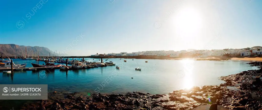 Sunlit harbour in La Gracioca, Lanzarote, Spain