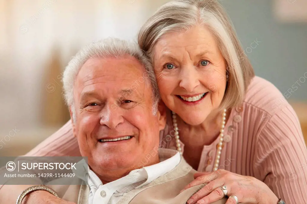 Senior couple looking at camera, portrait