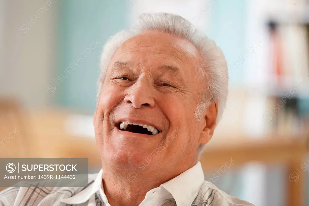 Senior man laughing, portrait