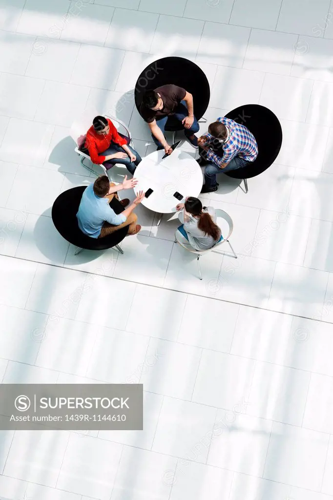 Overhead view of colleagues in meeting