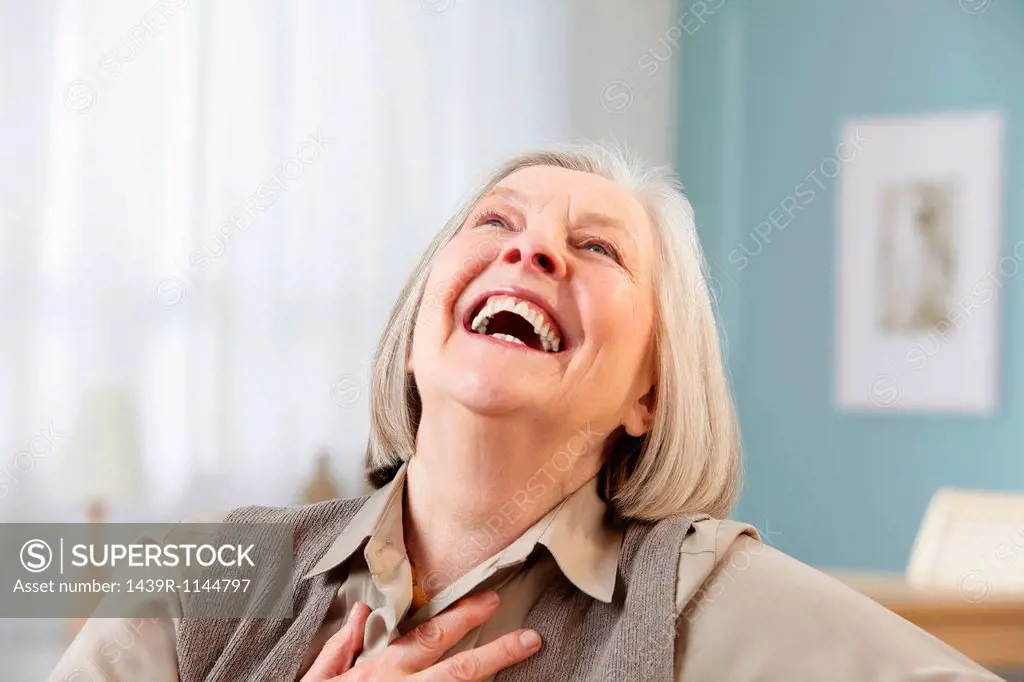 Senior woman laughing, portrait