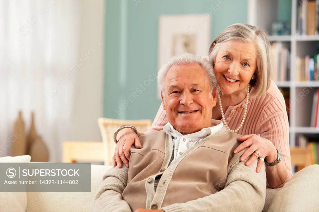 Senior woman with hands on mans shoulders