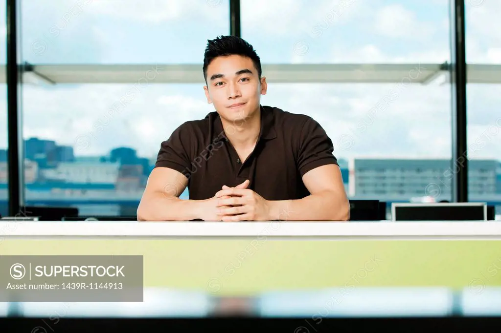 Young businessman sitting at desk