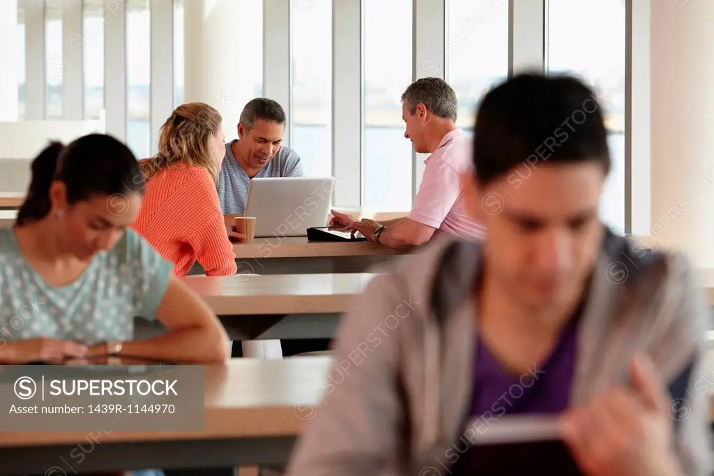 Mature students using laptop