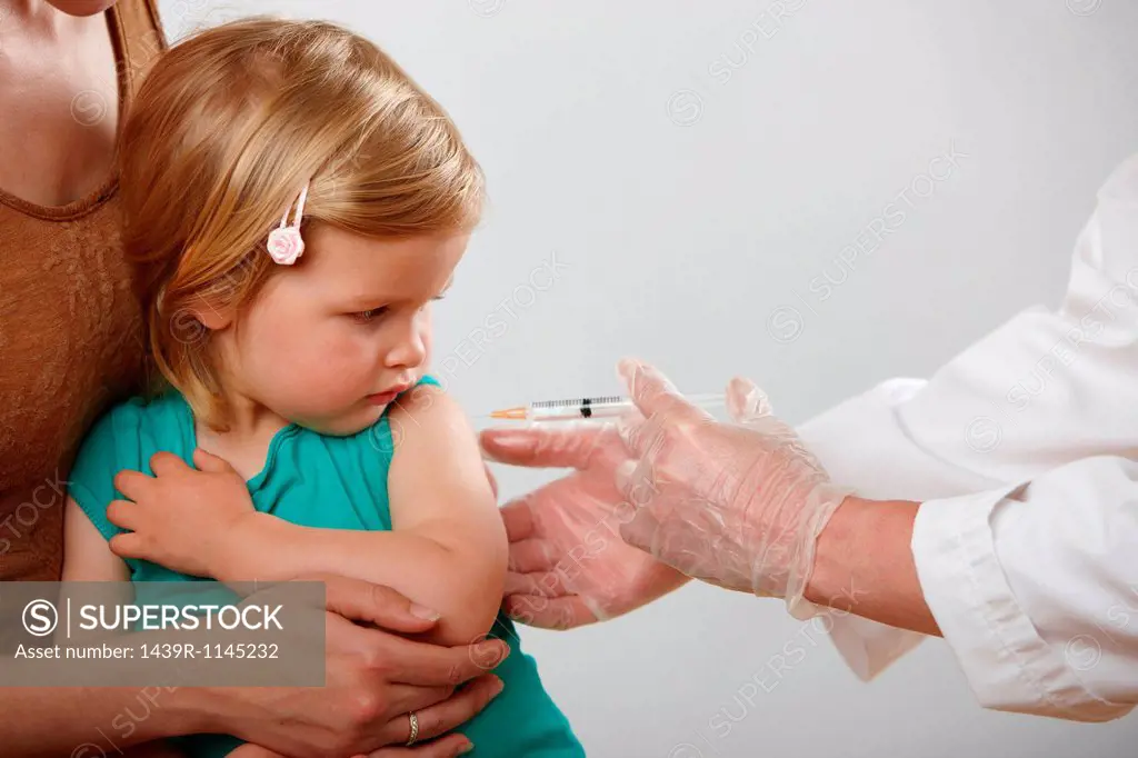 Little girl having an injection