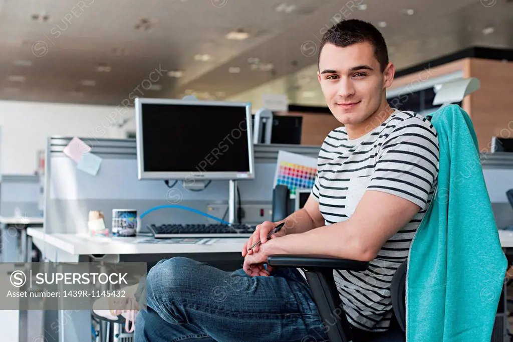 Portrait of man at desk