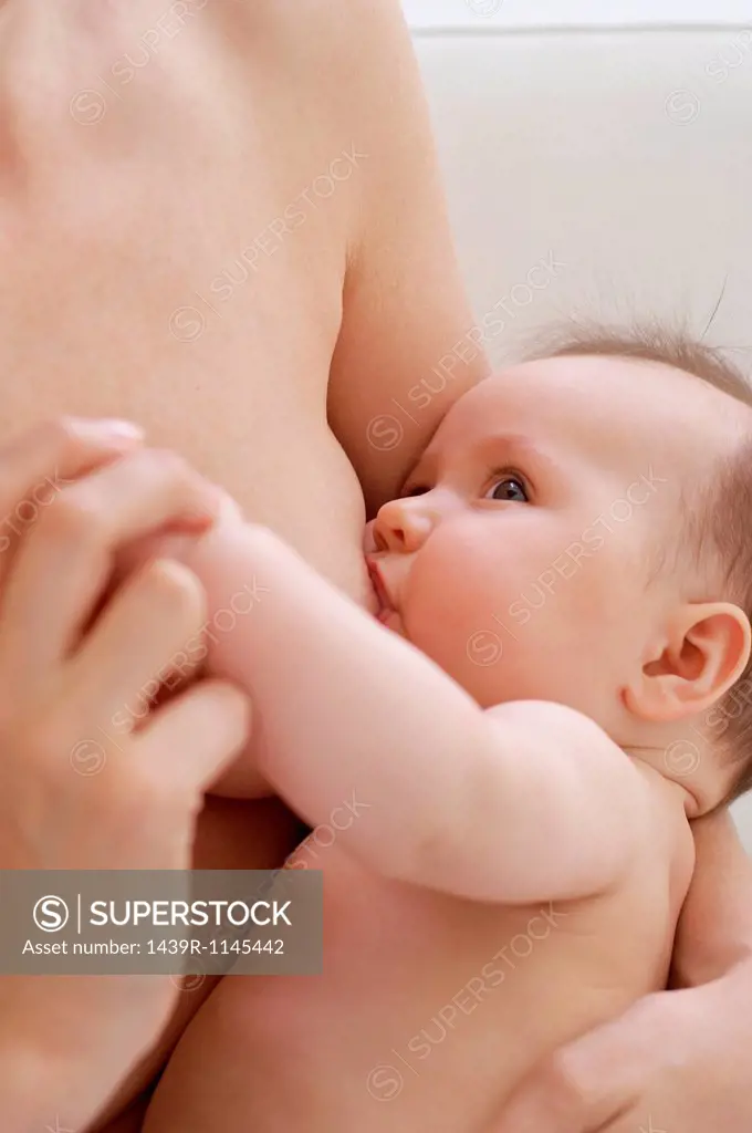 Mother breastfeeding baby