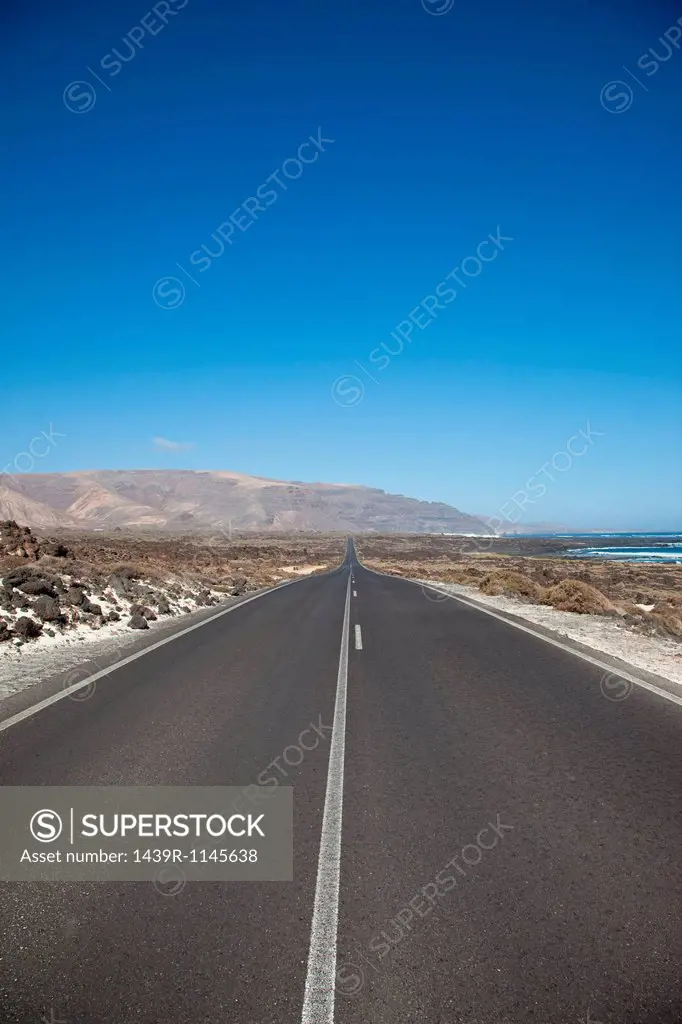Diminishing perspective of road in Lanzarote, Canary Islands