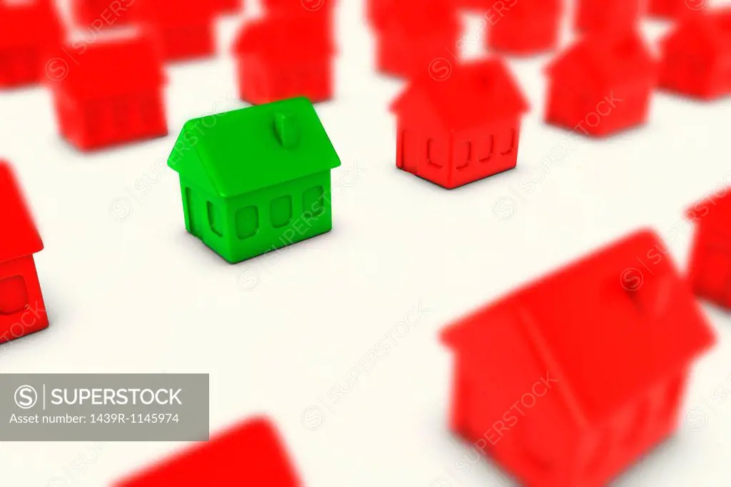 One green house amongst many red houses