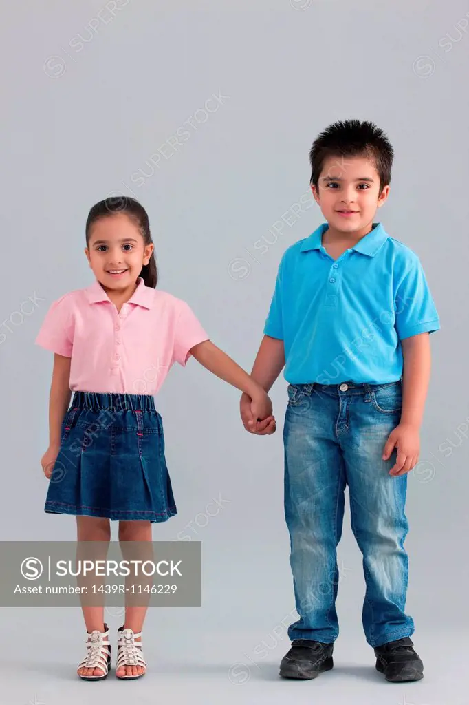 Brother and sister holding hands