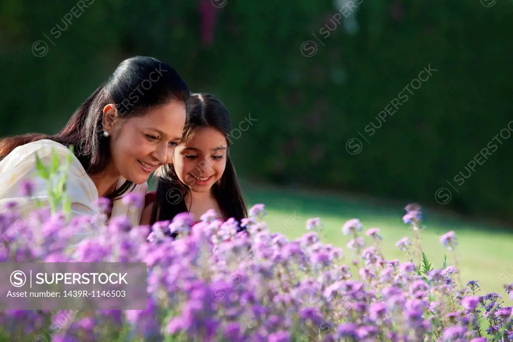 Girl and her grandmother in a garden