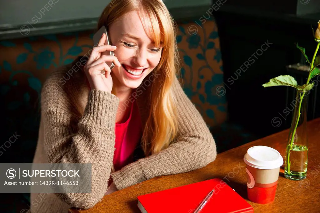 Woman on phone call laughing