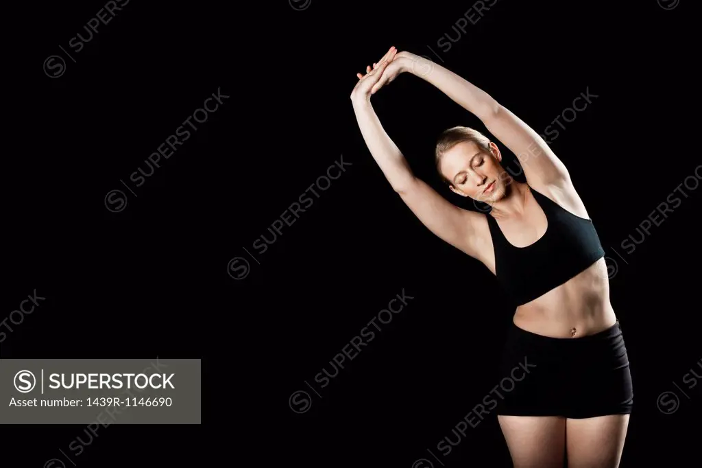 Athlete stretching waist