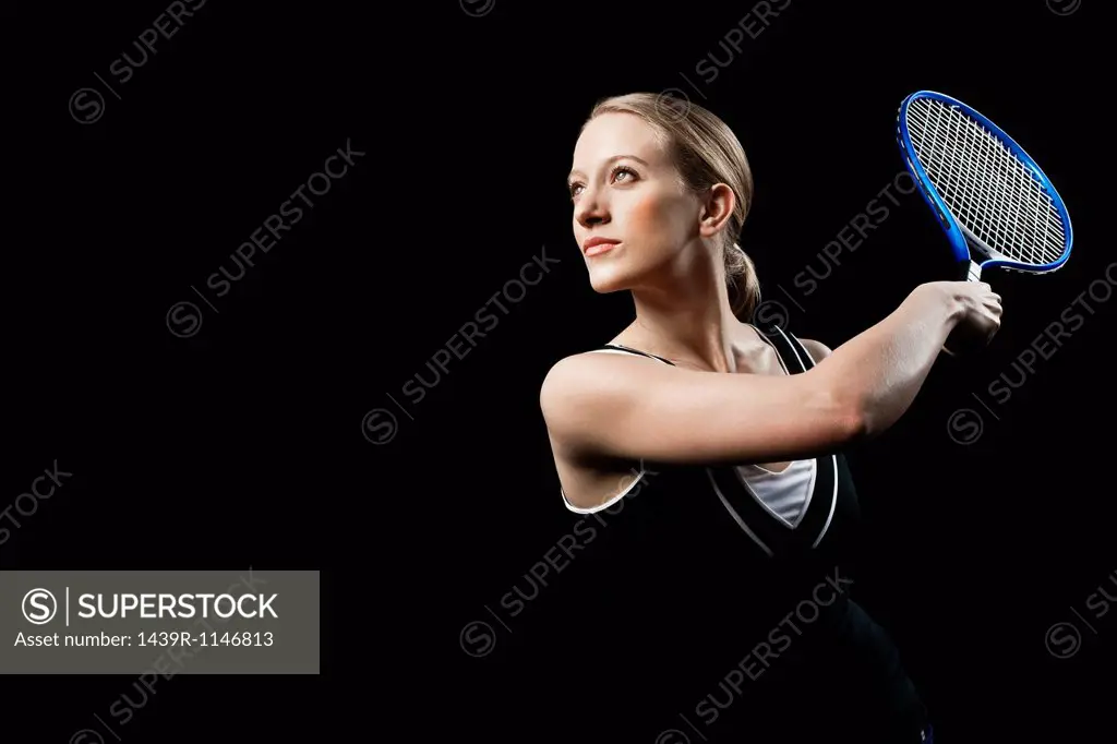 Tennis player holding racket