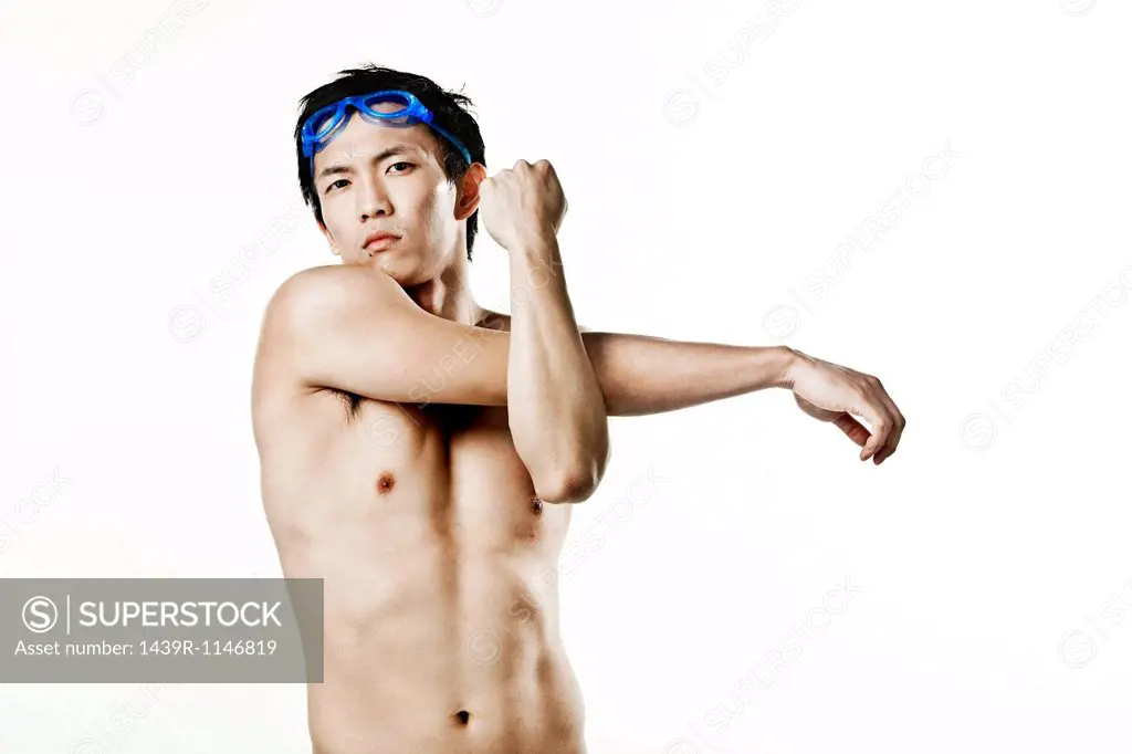Swimmer stretching arm, portrait