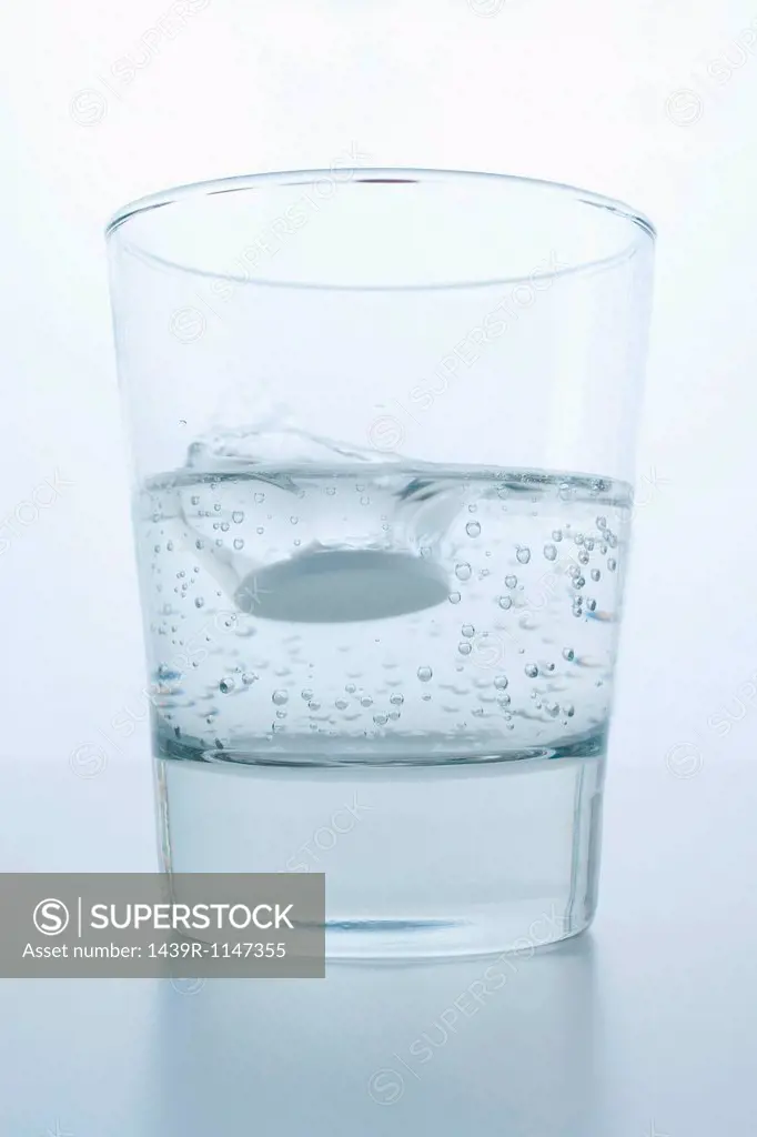 Pill in glass of water