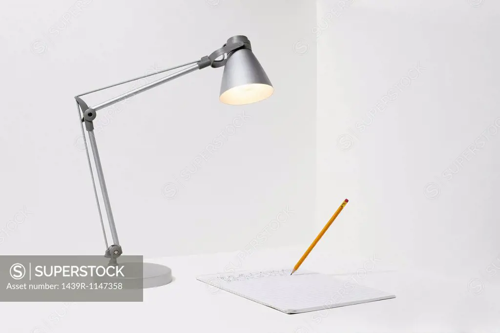 Lamp, pencil and paper