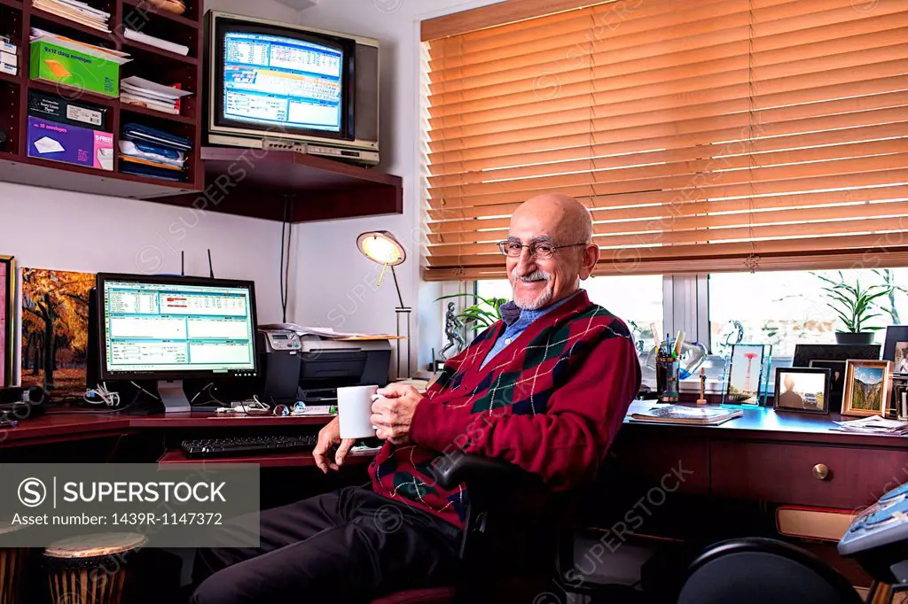 Senior man in his home office
