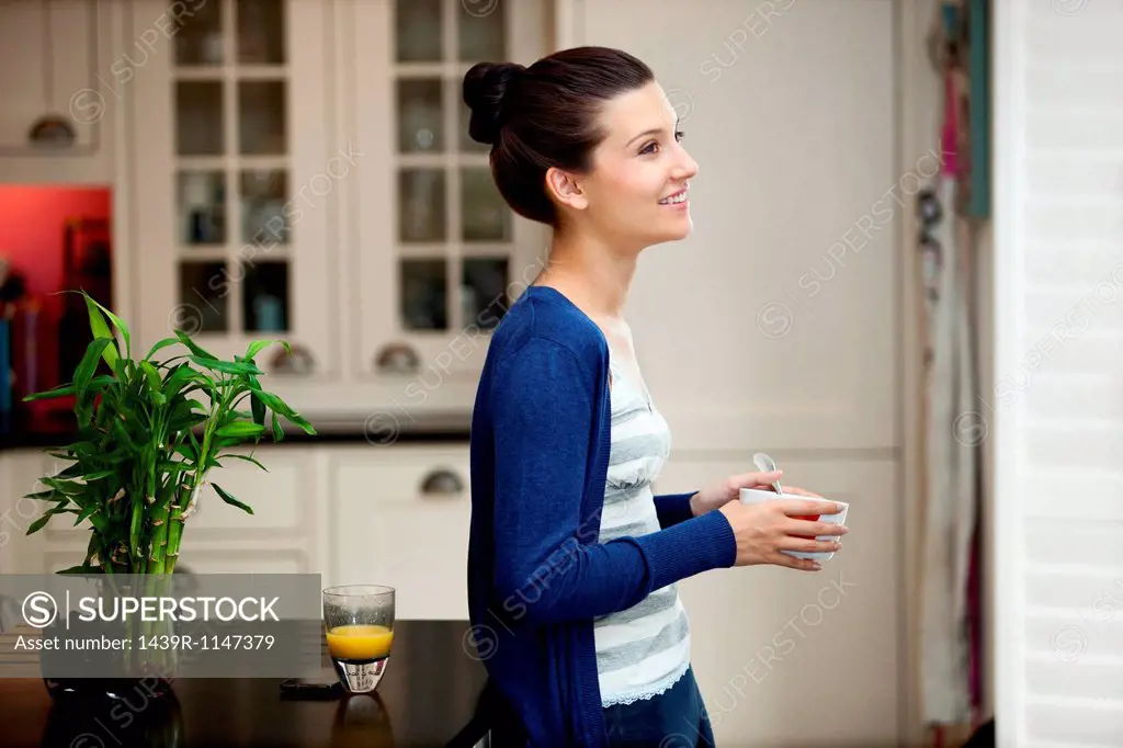 Young woman eating breakfast