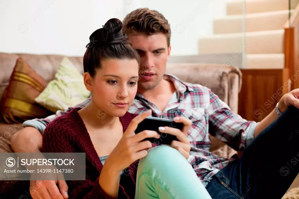 Young couple with smartphone