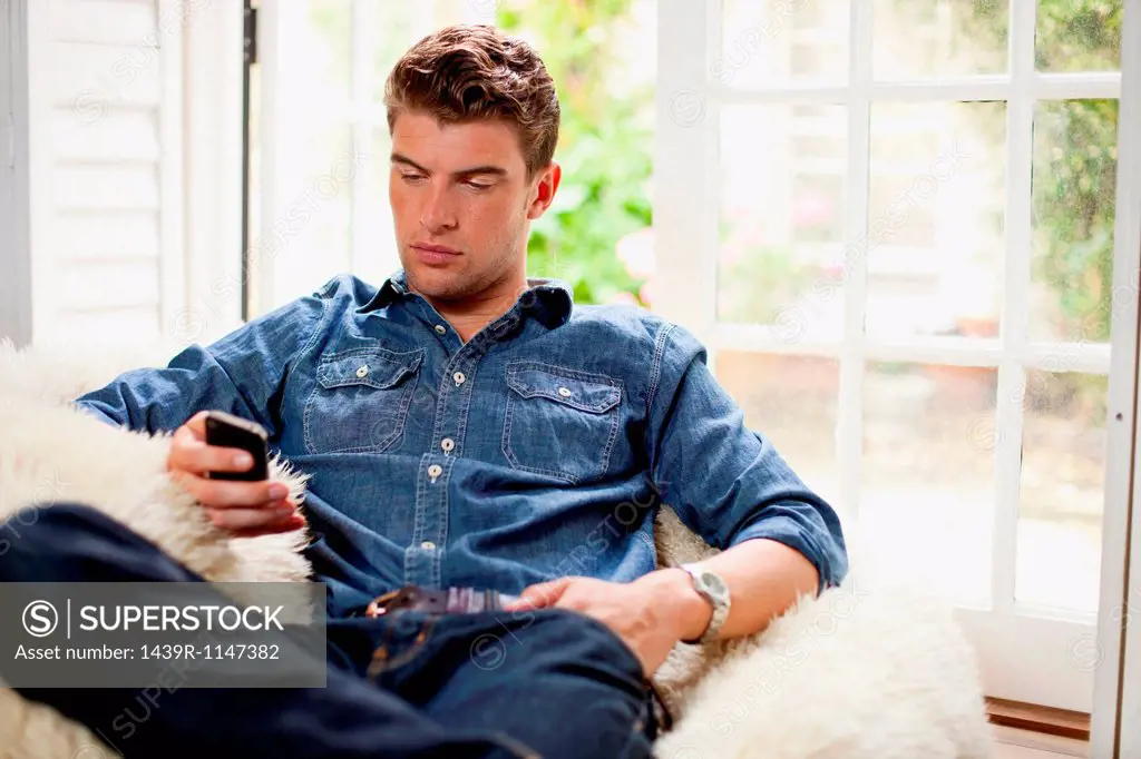 Young man holding smartphone