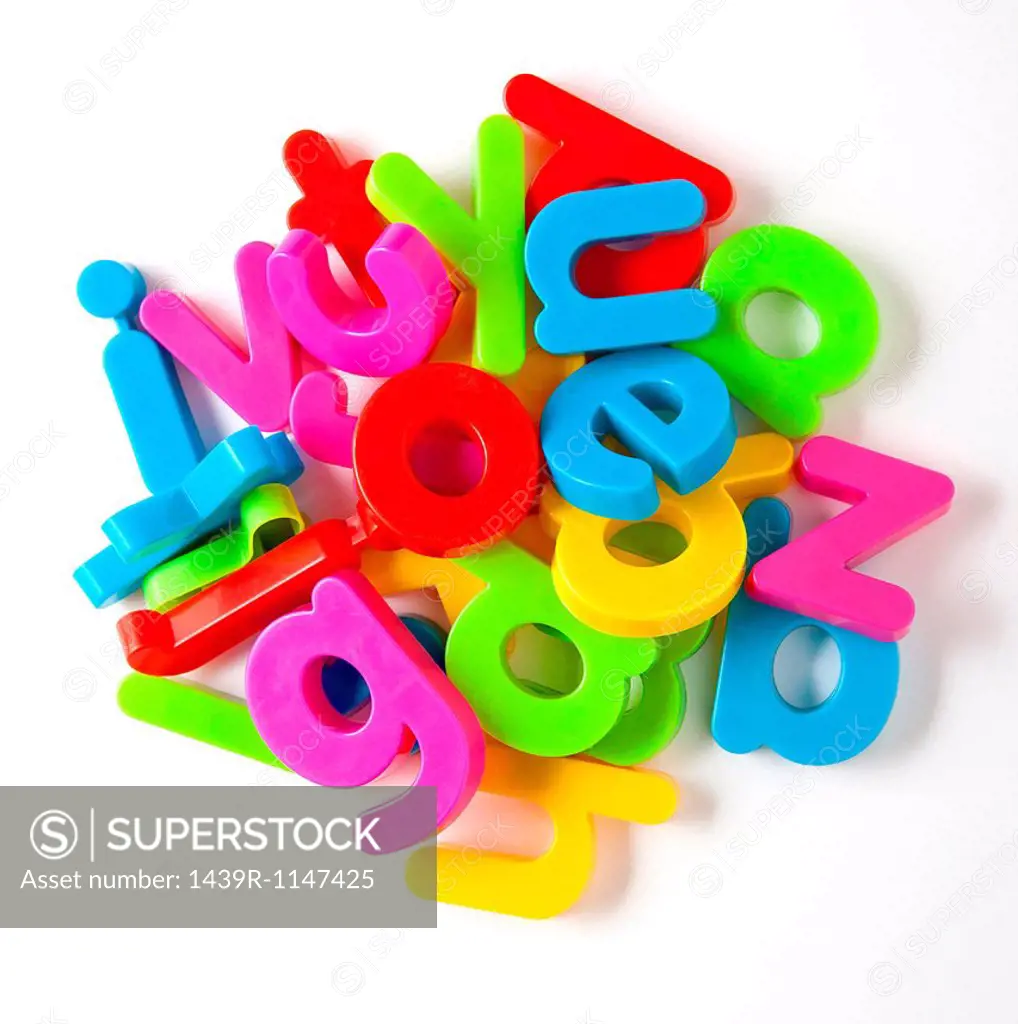 Alphabet fridge magnets in a pile